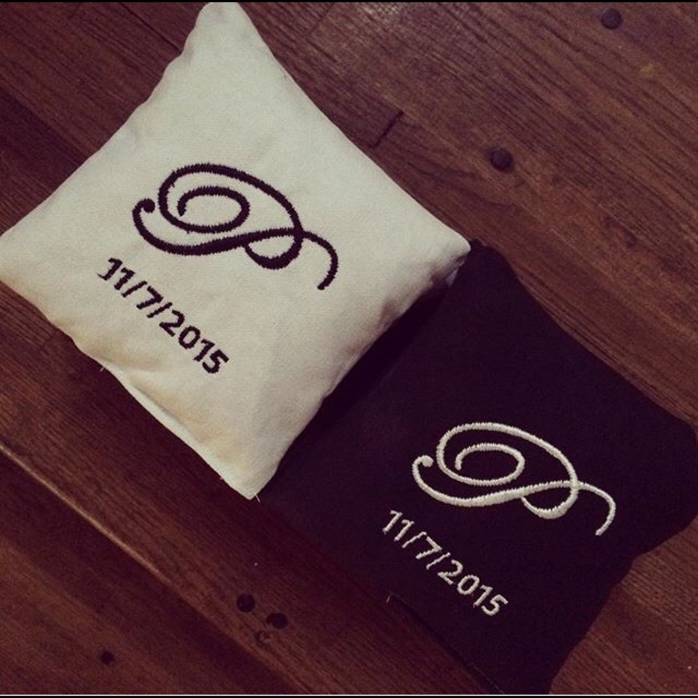 Custom monogrammed cornhole bags with wedding date